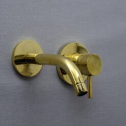 single handle unlacquered brass wall faucet hot and cold water