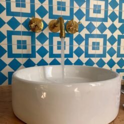 Unlacquered brass vintage wall mounted bathroom faucet with hammered finish & flat cross handles